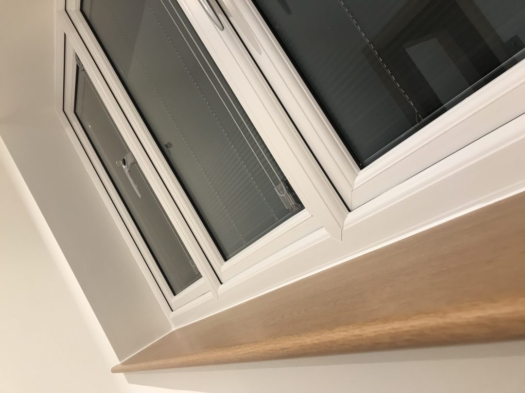 Window installation showing a white frame